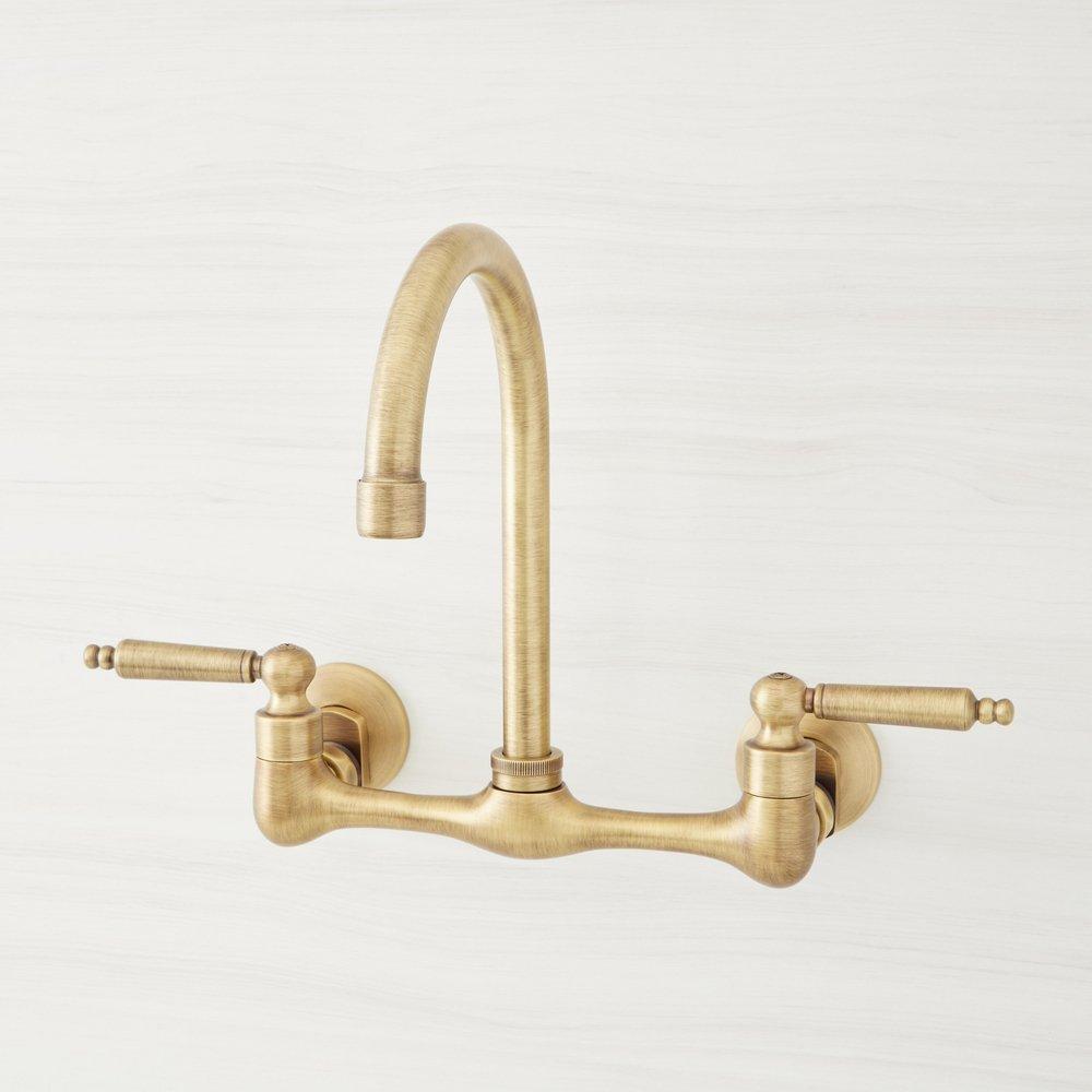 Signature Hardware Jessamy Two Handle Wall Mount Kitchen Faucet in Aged Brass