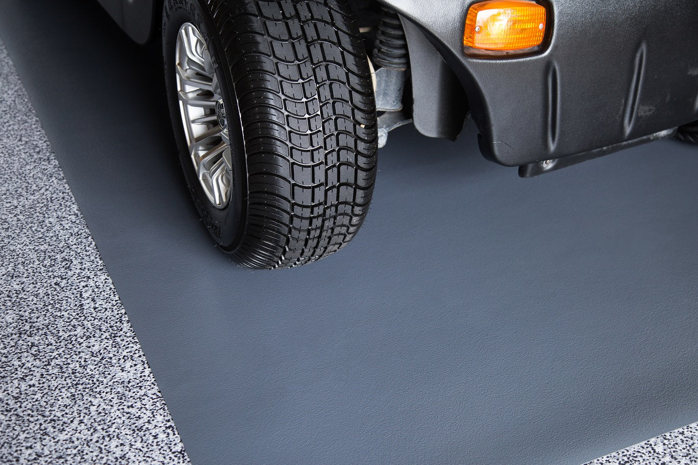 Golf cart wheel on Slate Grey Ceramic texture vinyl golf cart mat